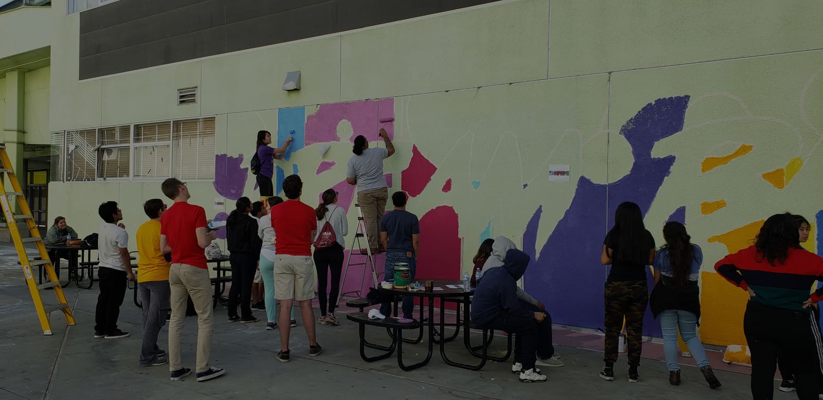 Students painting a mural